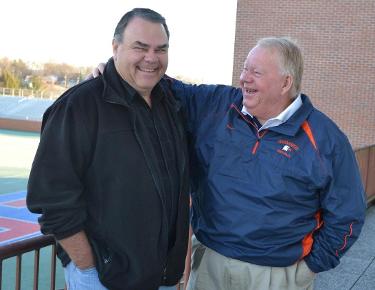 Saskatchewan Roughriders O-line coach Doug Malone '82 shares a laugh with his Eagles coach and close friend Mike Turner '73.