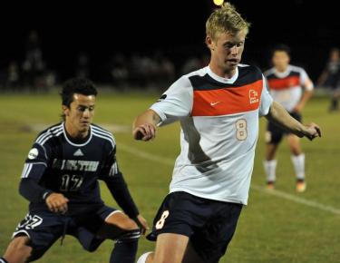 Sindre Welo dribble past an LMU defender
