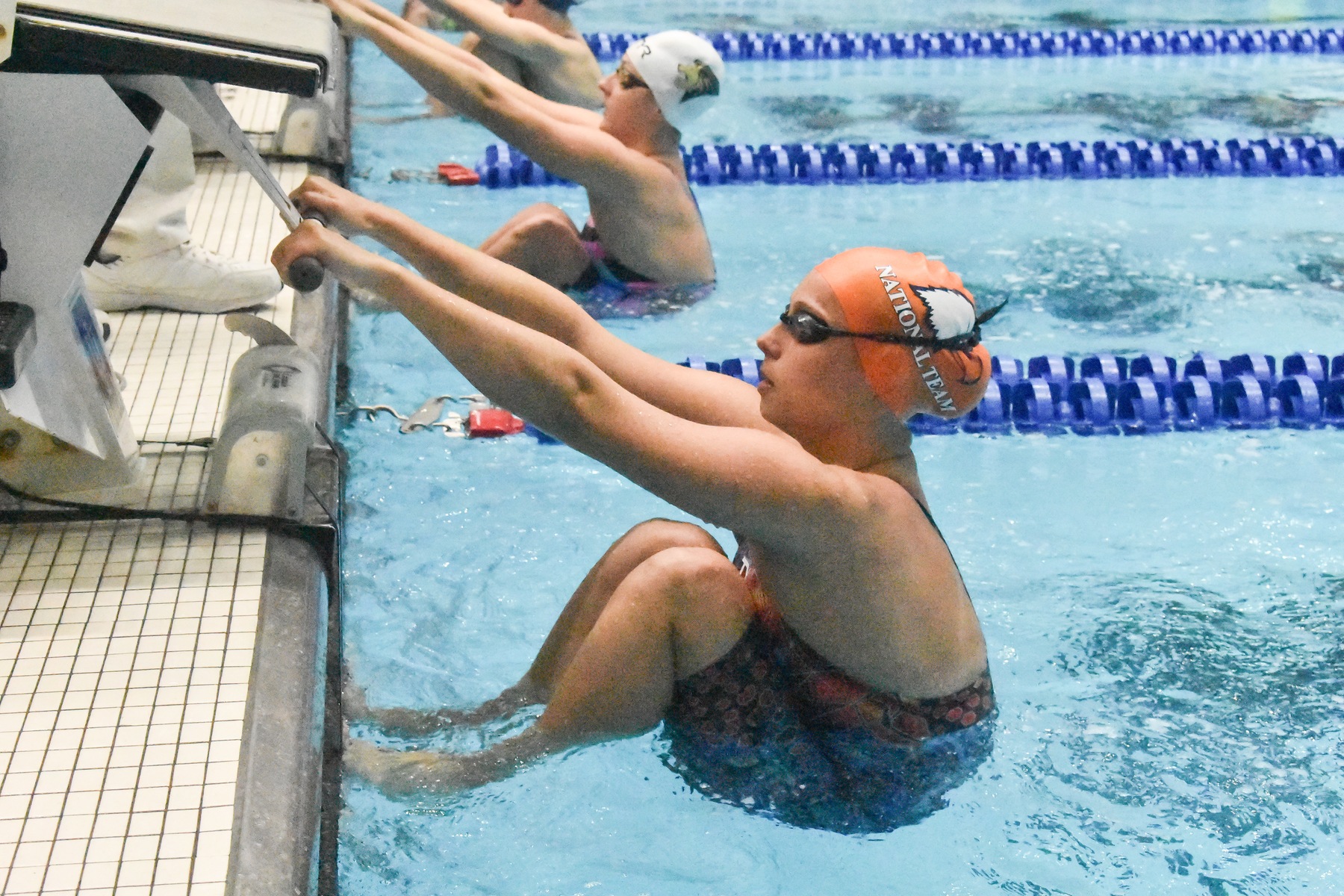 Jensen, George post school records in prelims of second day at Nationals